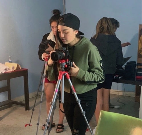 girl operates camera