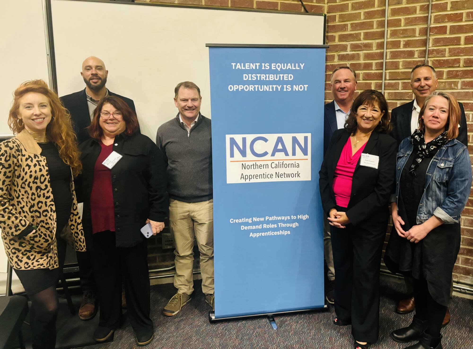 NCAN members celebrate National Apprenticeship Week 2024 at Laney College. L-R: Kelly Cure, Orrian Willis, Raya Zion, Matt Regan, John Dunn, Patti Castro, Rick Rafey, Anita Gay.